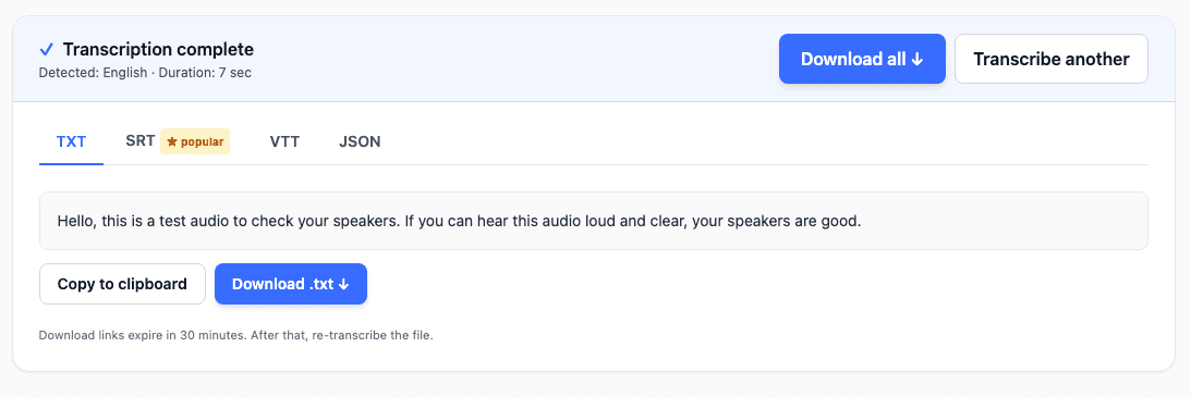 Transcription complete with TXT, SRT, VTT, and JSON tabs and a Download all button